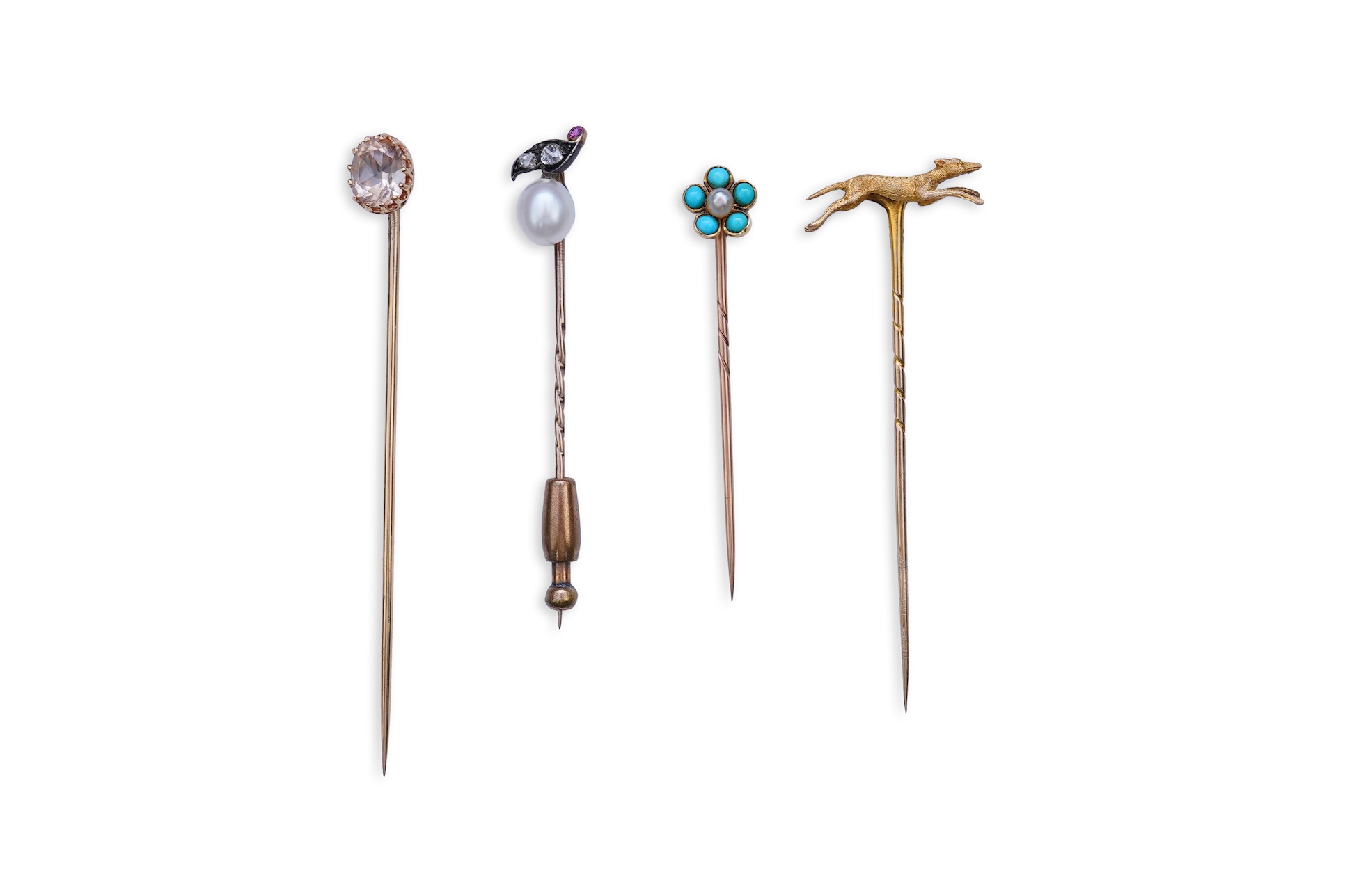 A collection of four tie pins, circa 1900